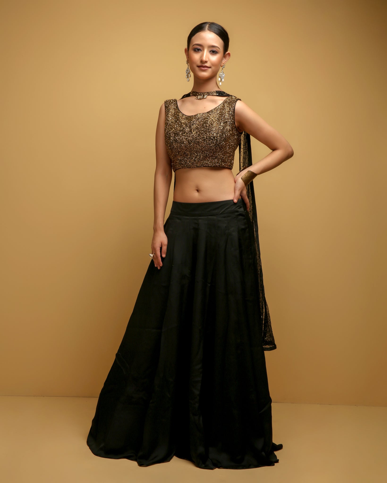 Priva Collective - PV 4304 : Black and Black lehenga - SOLD Get party ready  this season in this Black crop top skirt. Black embroidered waist belt.  with black net skirt Blouse :