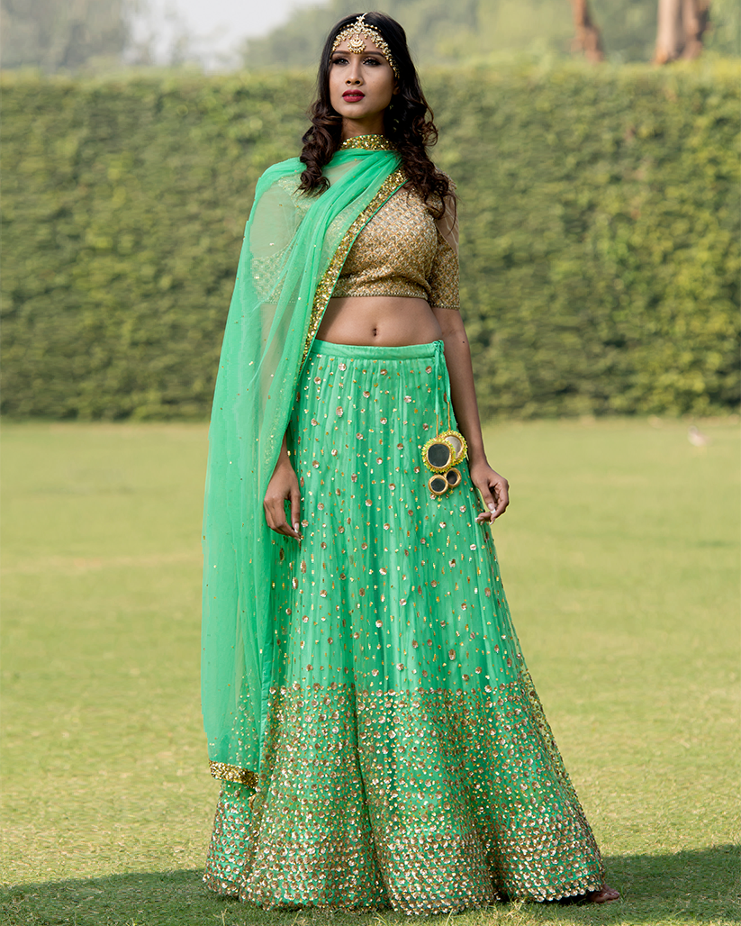 Living-Fifties-Fashion - Emerald green lehenga with golden work and a blush  pink dupatta. https://www.utsavfashion.com/ | Facebook